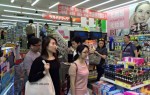 Foreign tourists hunt for cosmetics at a drugstore in Osaka.